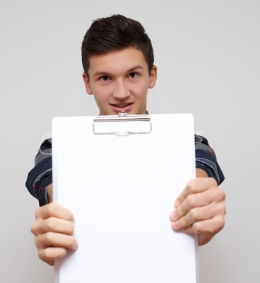 A smiling handsome male with blank board
