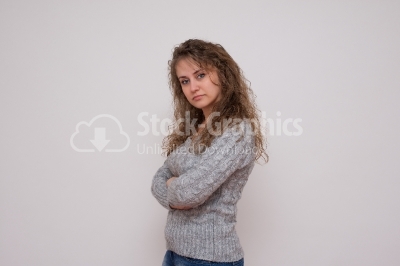 A young woman with arms crossed