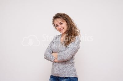 A young woman with arms crossed