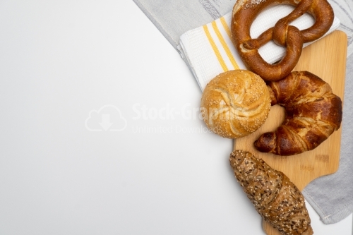 Assorted bread on white background