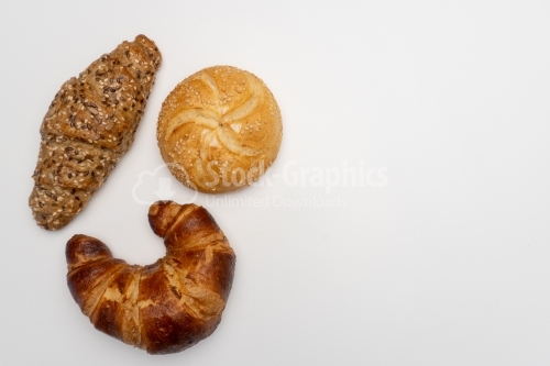 Assorted breads on white backgrounds