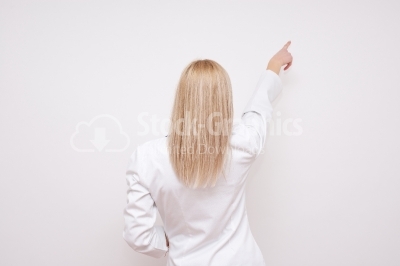 Beautiful female doctor. Rear view - Stock Image