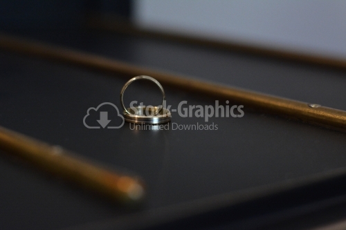Beautiful wedding rings on the table.