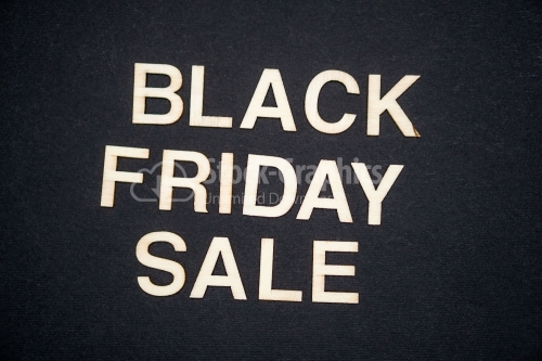 BLACK FRIDAY SALE word written on dark paper background. BLACK FRIDAY SALE text for your concepts