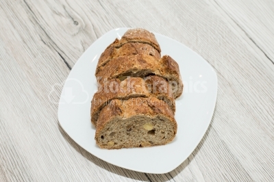 Bread cut sliced â€‹â€‹on a white plate