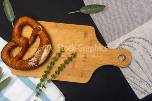 Brezel on a wood cooking board