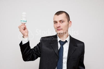 Business Man holding a Light Bulb