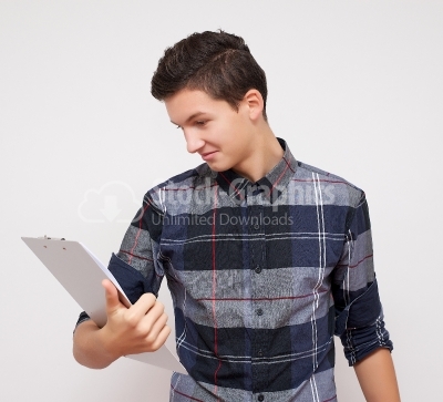 Business young boy reading a document.