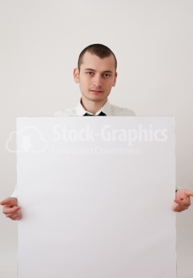 Businessman pointing at a placard