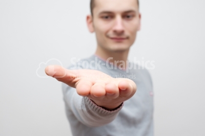Businessman showing something on the palm of his hand