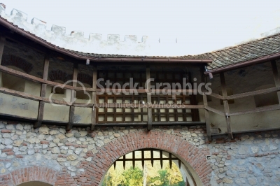 Castle gate and rock wall.