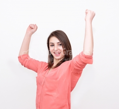 Casual young woman happy - isolated over a white background
