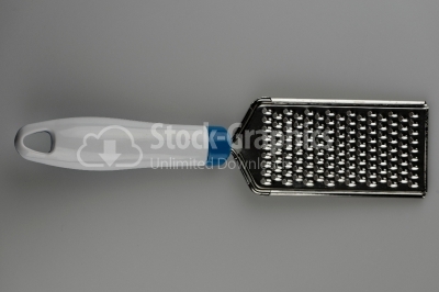 Cheese grater on white - Stock Image