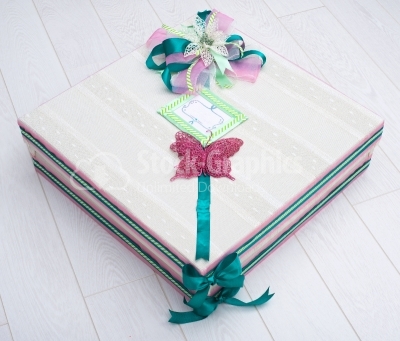 Christmas box with green scarf and purple buterfly