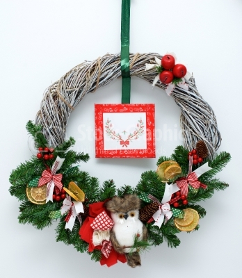 Christmas wreath with toys isolated on white background