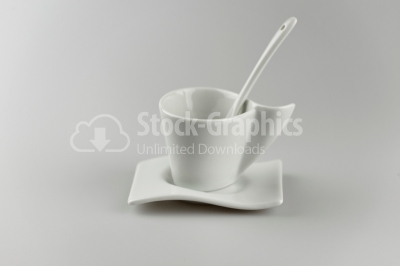 Cup with spoon in tray