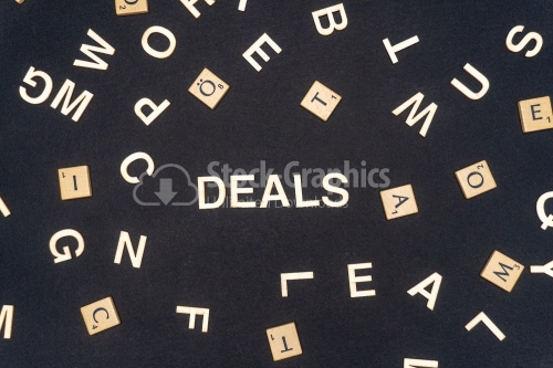 DEALS word written on dark paper background. DEALS text for your concepts