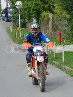 Enduro racer sitting on his motorcycle