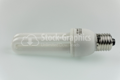 Energy saving fluorescent light bulb on white bakground - Stock 