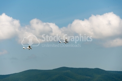 Flying propeller planes over the mountains