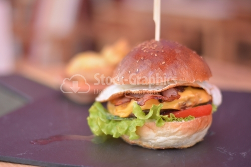 French burger on the black slate signboard