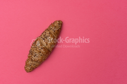 French croissant on a pink background