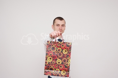 Gentleman holding some shopping bags
