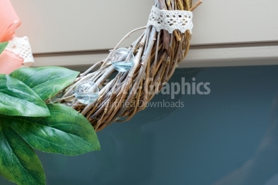 Glass balls filled with blue water on spring wreath