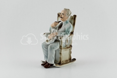 Grandfather sitting on chair with dog on white background
