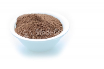 Ground cocoa in white bowl