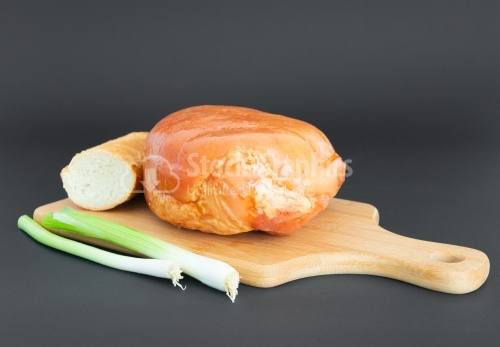 Ham on a wood plate
