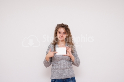 Happy smiling young business woman showing blank signboard, isol