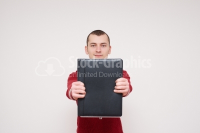 Happy smiling young man with black folder, isolated over white b