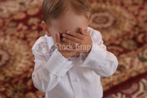 Hiding. Baby boy is playing in cuckoo