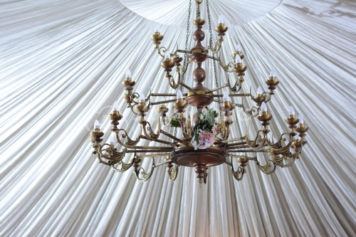Huge chandelier inside wedding tent