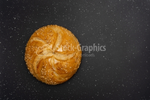 Kaiser bread on a dark background