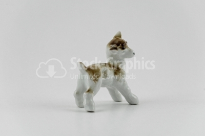 Little sheep porcelain figurine isolated on white