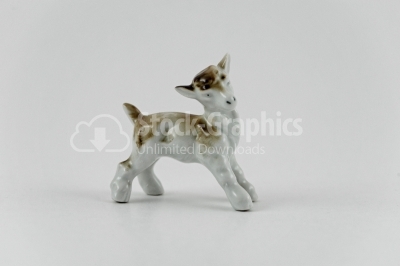 Little sheep porcelain figurine on white
