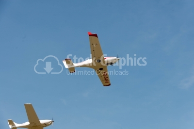 Low-angle flying propeller planes close-up