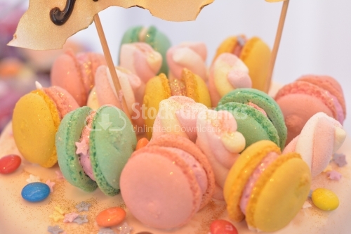 Macro view of a cake with colorful macarons