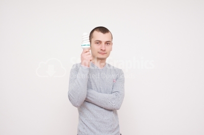 Man holding fluorescent light bulb in hand