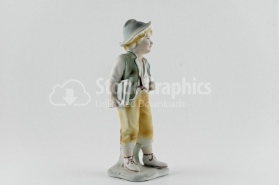 Old-fashion kid porcelain figure on white
