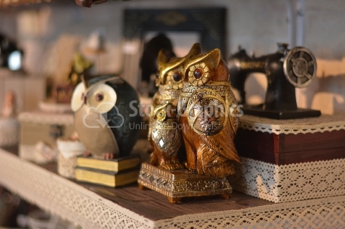 Owl statue, trinket as a decoration object on flat background.