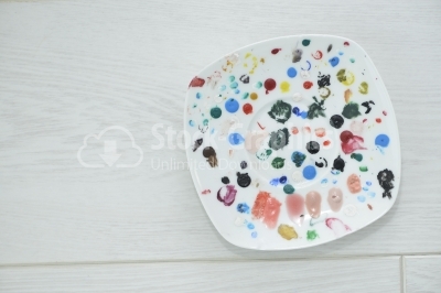 Palette with spots of acrylic colors