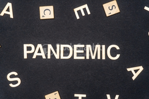 PANDEMIC word written on dark paper background. PANDEMIC text for your concepts