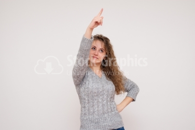 Pointing up woman - Stock Image