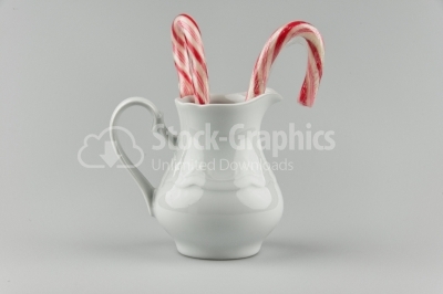 Porcelain teapot and candies - Stock Image
