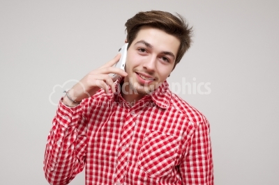 Portrait of a handsome young man taking a call