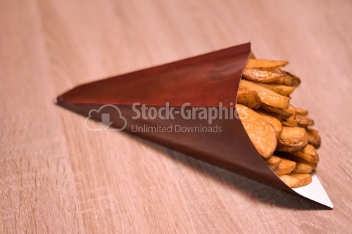 Potatoes wedges in paper cone