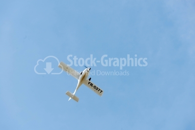 Propeller plane on a sunny sky